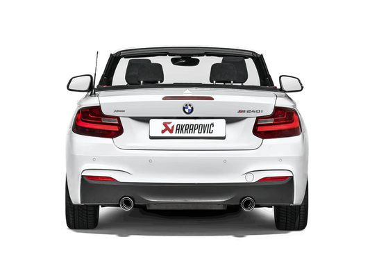 Rear view of a white BMW M240i with an Akrapovic twin pipe exhaust fitted