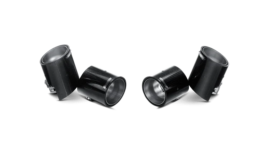 a group of Akrapovic black metal pipes