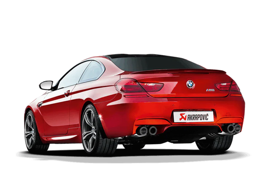 Near side rear view of a red BMW M6 with an Akrapovic twin pipe each side exhaust & carbon fibre tips fitted