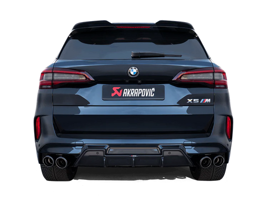 Rear view of a dark blue BMW X5M with an Akrapovič twin pipes each side exhaust & an Akrapovič carbon fibre rear diffuser fitted
