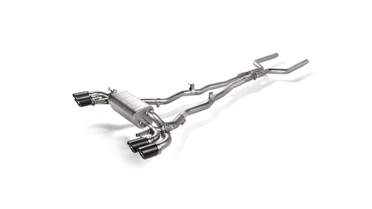 Aerial side view of a titanium Akrapovič exhaust system with silencers and quad carbon fibre tips