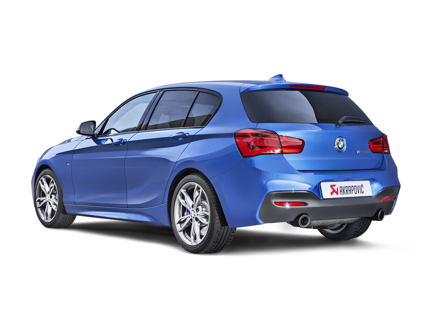 Side and rear view of a blue BMW M140i F20 F21 with Akrapovič exhaust