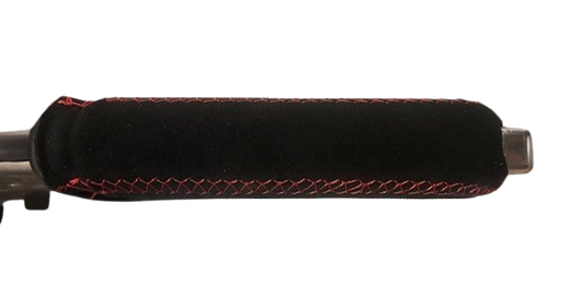 Close up top view of a Toyota GR Yaris handbrake lever handle in black Alcantara with Red stitching