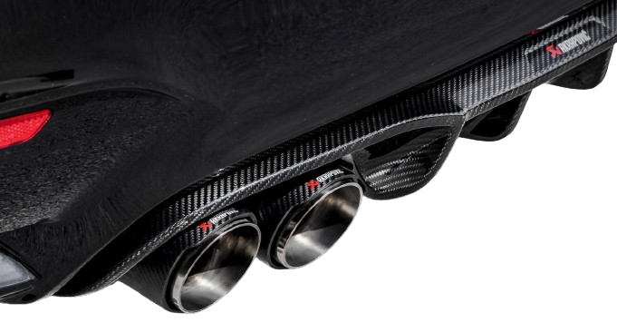 Close-up of a Blue car's rear with Akrapovic carbon fibre exhaust tips and diffuser