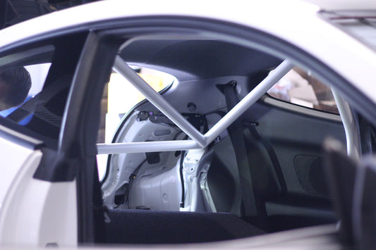 Image of a White half roll cage fitted to a White Toyota GR Yaris