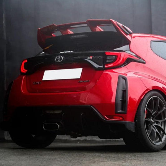 Rear view of Red Toyota GR Yaris fitted with a TOM'S rear spoiler painted Red