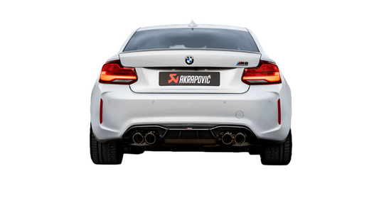 Rear view of a white BMW M2 Competition F87N with Akrapovic exhaust, with quad carbon fibre tips, fitted