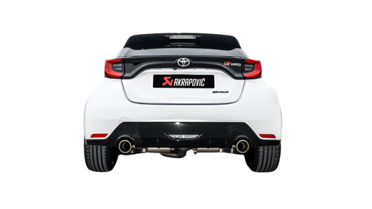 Rear view of a white Toyota GR Yaris with an Akrapovič exhaust, with a pipe each side, fitted