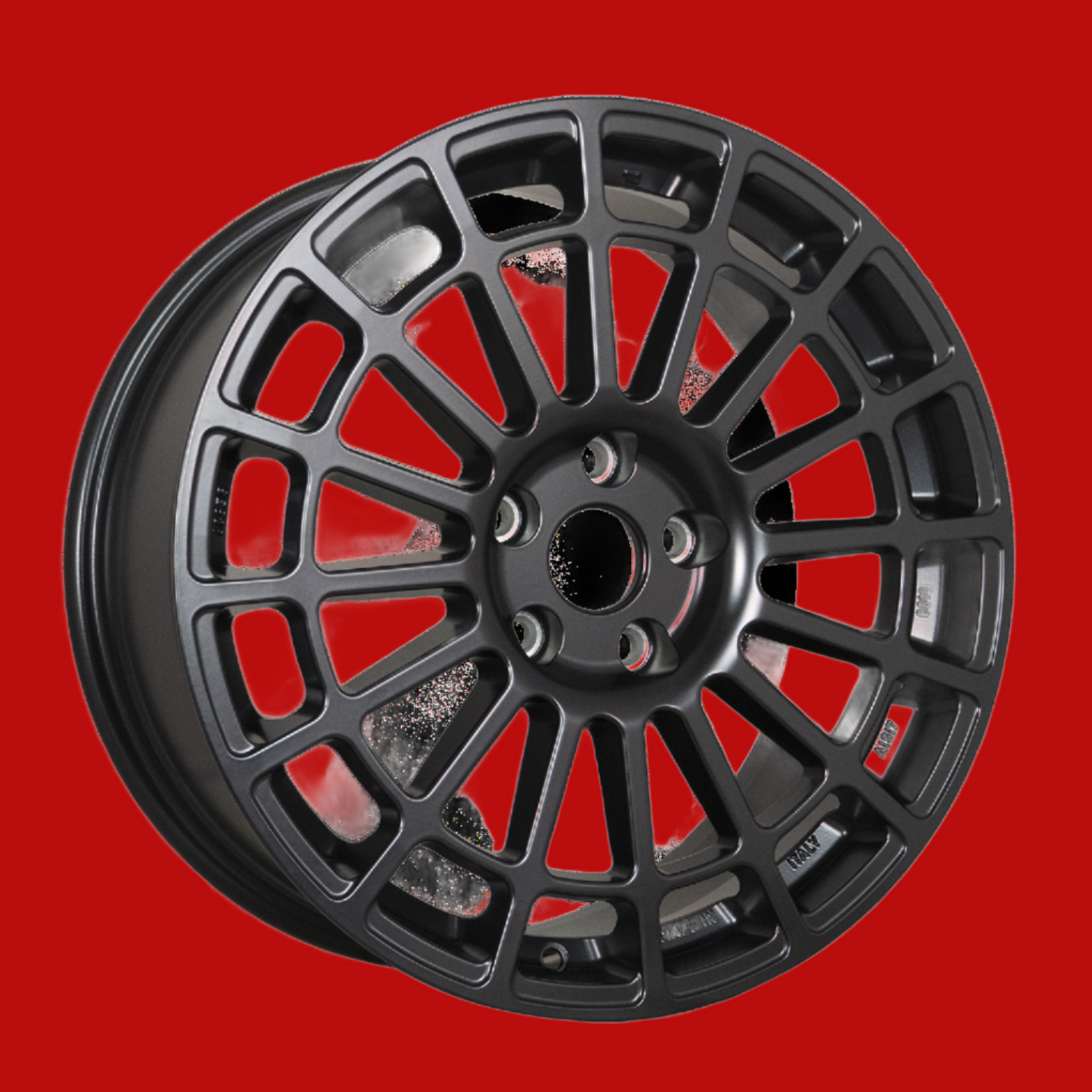 Front view of a Monte Corse 18-inch anthracite wheel with a multi-spoke design against a red background