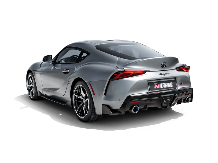 Nearside rear view of a Toyota Supra A90 in silver with an Akrapovič twin pipe exhaust fitted