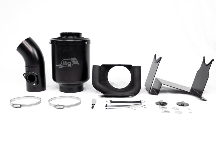 View of an ITG Maxogen cold air induction kit with all the various parts laid out on a white surface