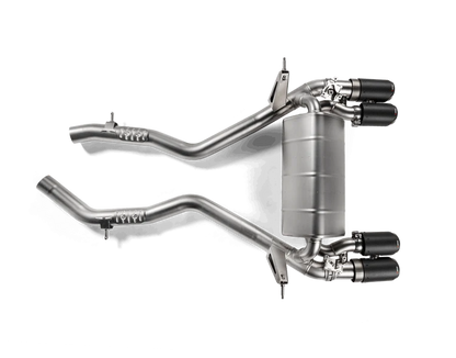 Aerial view of an Akrapovic titanium rear exhaust section with twin pipes either side at the rear & two single pipes each side to the front, with carbon fibre tips