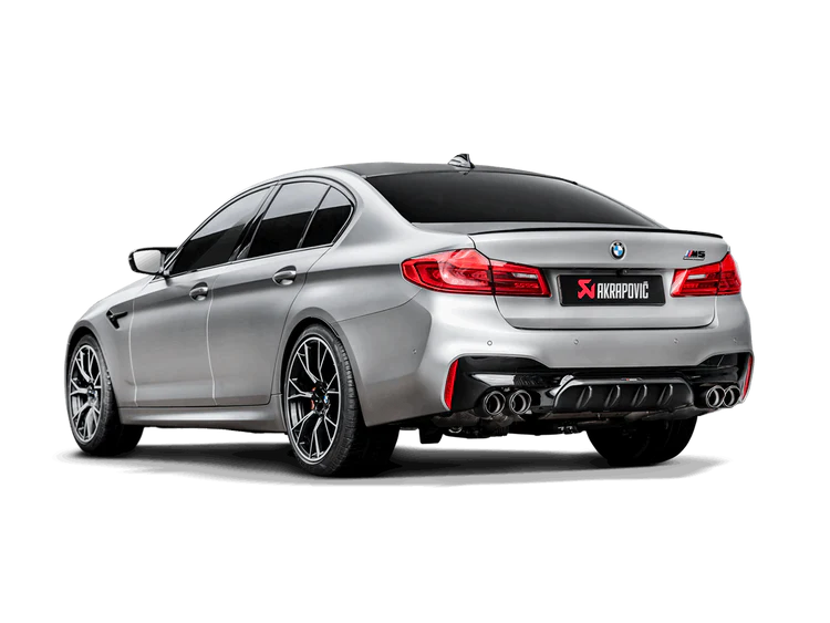 Rear view of a silver BMW M5 F90 with an Akrapovic Titanium rear exhaust with twin pipes each side, carbon fibre tips & a carbon fibre rear diffuser