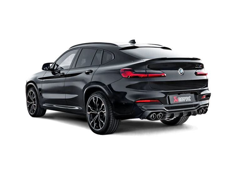 Nearside rear view of a black BMW X4M with an Akrapovič exhaust with twin pipes each side & an Akrapovič carbon fibre rear diffuser fitted