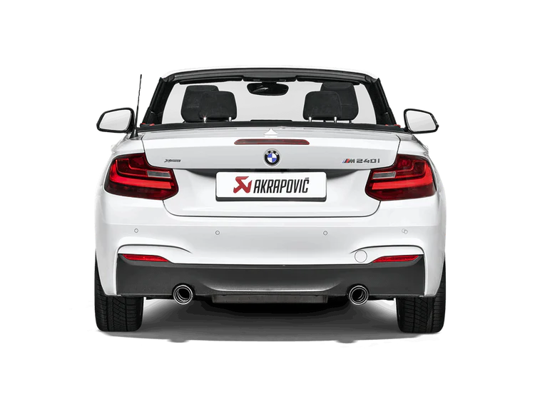 Rear view of a white BMW M240i with an Akrapovic twin pipe exhaust fitted
