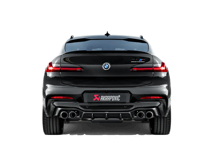 Rear view of a black BMW X4M with an Akrapovič exhaust with twin pipes each side & a carbon fibre rear diffuser fitted