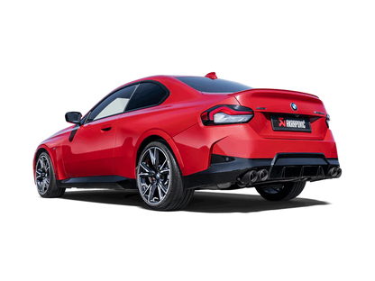 Near side rear view of a red BMW M240i with an Akrapovic Titanium rear exhaust, with twin pipes & carbon fibre tips each side, fitted 