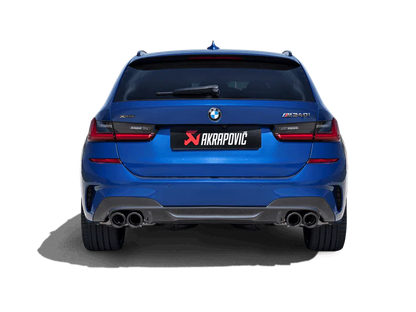 Rear view of a blue M340i Grand Coupe with an Akrapovic exhaust, twin pipes each side, fitted