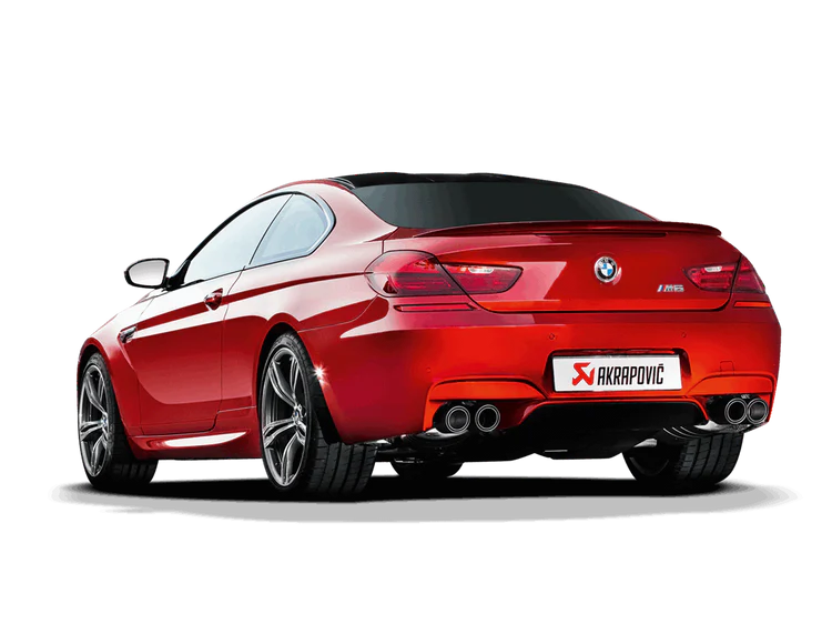 Near side rear view of a red BMW M6 with an Akrapovic twin pipe each side exhaust & carbon fibre tips fitted