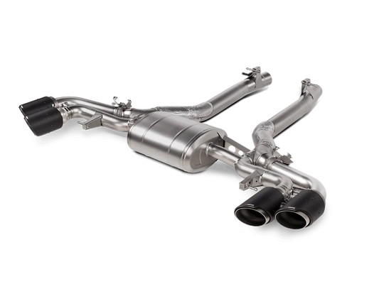 Aerial front side view of a titanium Akrapovič exhaust system with quad exhaust tips in carbon fibre & two separate single pipes out of the rear