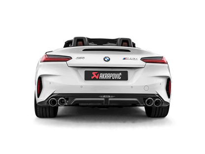 Rear view of a white BMW Z4 M40i with an Akrapovič exhaust, with twin pipes each side, and a carbon fibre rear diffuser fitted