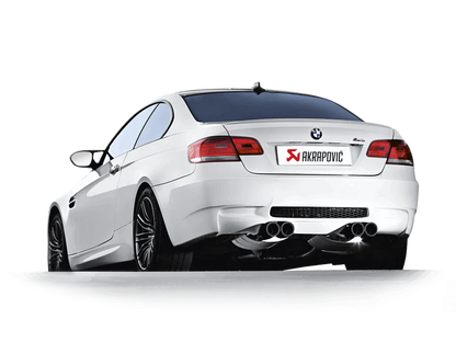 Near side rear view of a white BMW M3 with an Akrapovic carbon tail pipe set