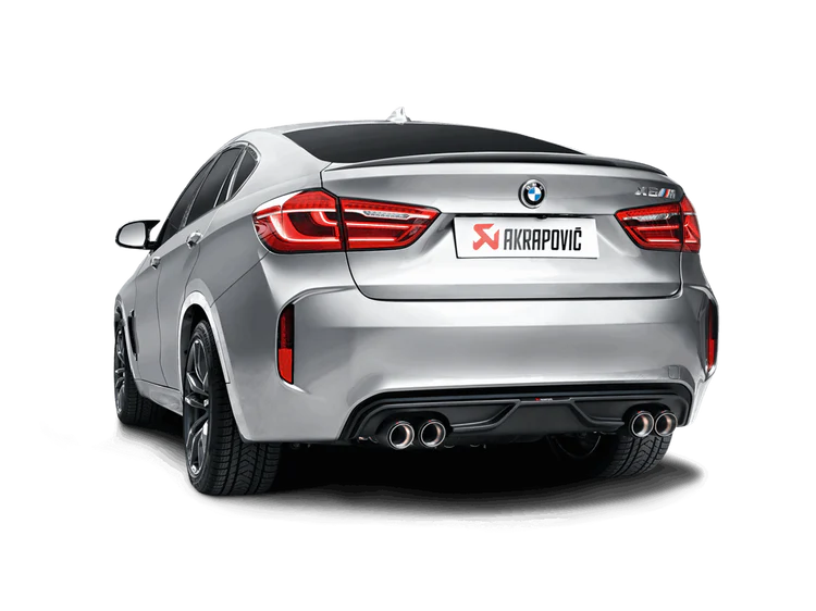 Nearside rear view of a silver BMW X6M with an Akrapovič twin pipes each side exhaust & an Akrapovič carbon fibre rear diffuser fitted
