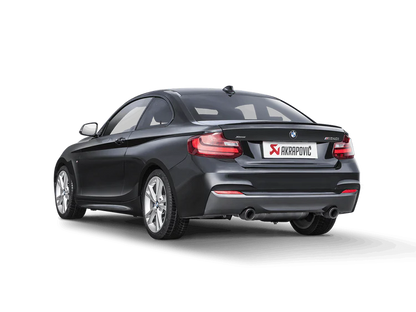 Near side rear view of a Grey BMW M240i with an Akrapovic Titanium rear exhaust with twin pipes & carbon fibre tips fitted