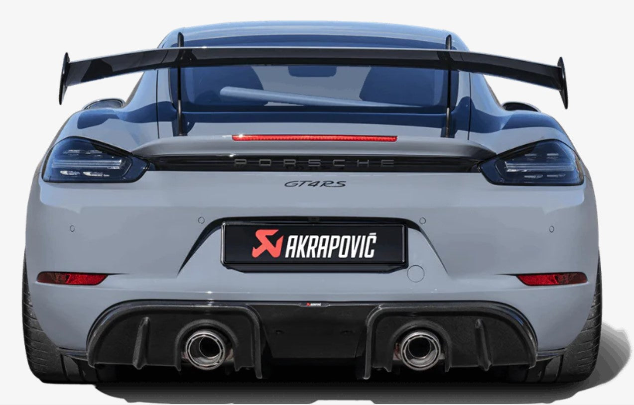 Rear view of a grey Porsche GT4RS with an Akrapovič twin pipe exhaust & rear carbon fibre diffuser fitted