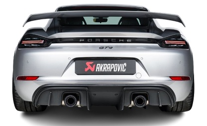 Rear view of a silver Porsche GT4 with Akrapovič diffuser & twin tail pipes fitted