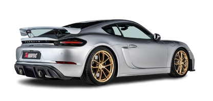 Offside rear view of a silver Porsche GT4 with Akrapovič diffuser & twin tail pipes fitted