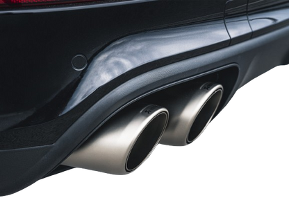 View of a pair of Akrapovič twin double round tail pipes with a high grade Titanium finish fitted to a vehicle with a rear diffuser