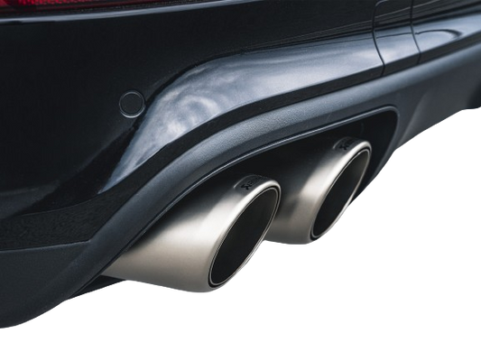 View of a pair of Akrapovič twin double round tail pipes with a high grade Titanium finish fitted to a vehicle with a rear diffuser