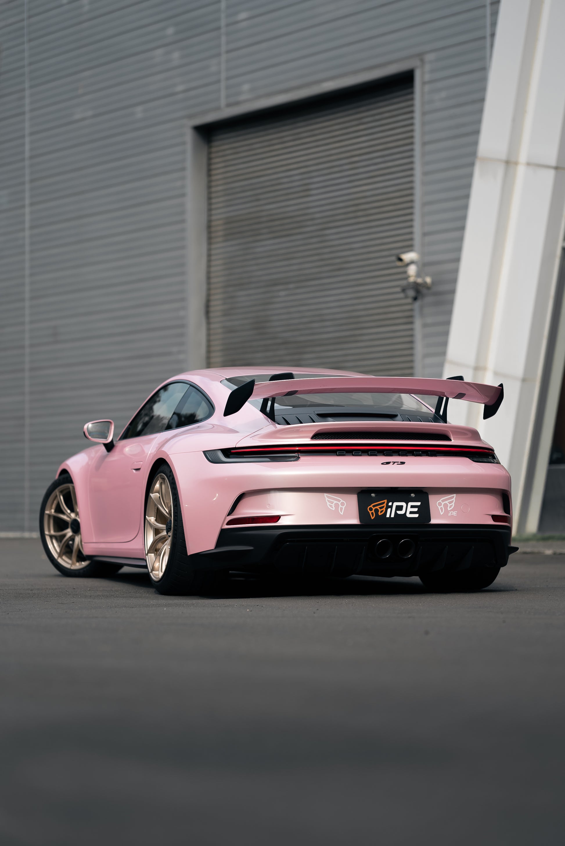 Nearside rear view of a Pink Porsche GT3 with IPE MFR-01 Magnesium wheels fitted