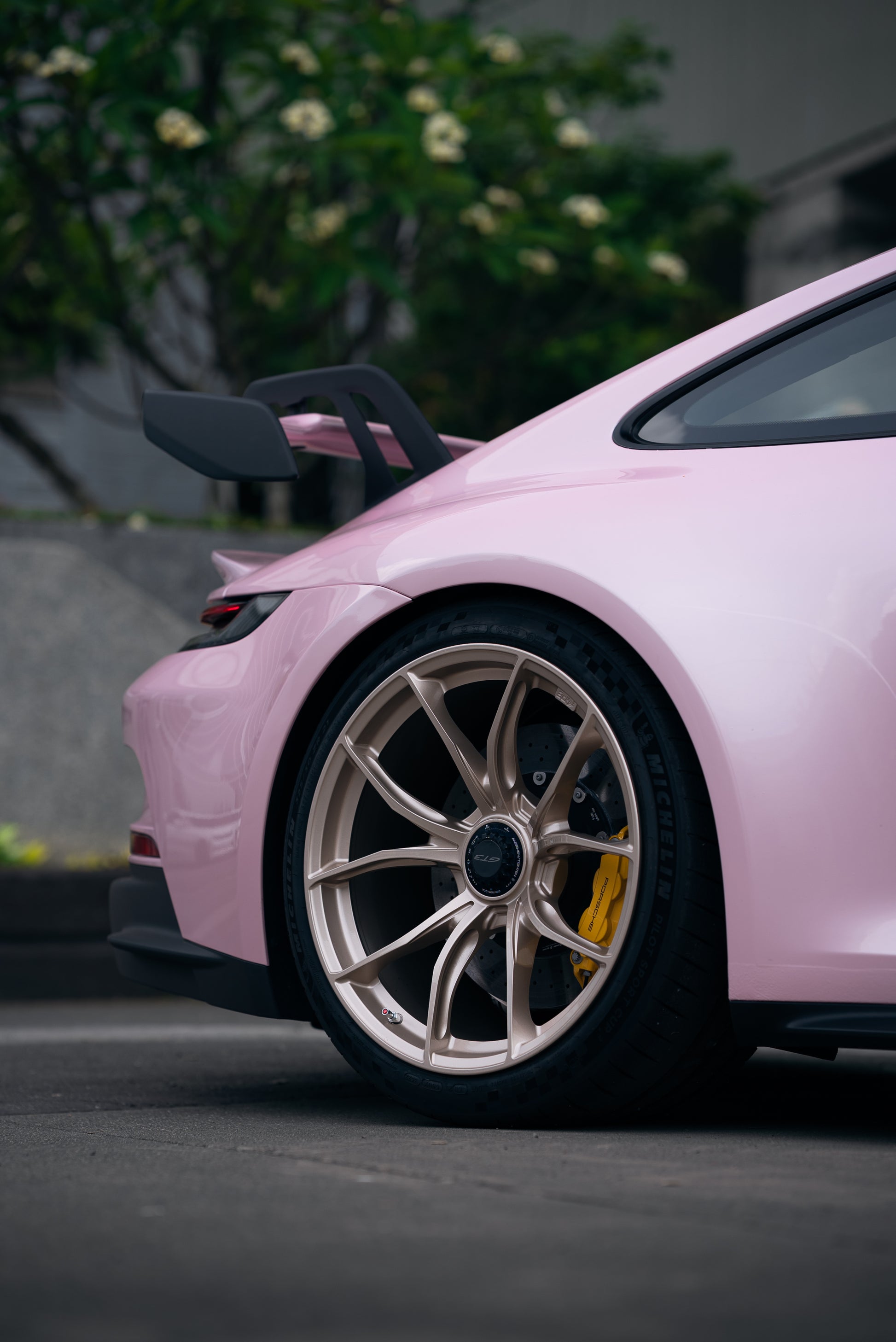 View of the offside rear quarter of a Pink Porsche GT3 with an IPE MFR-01 Magnesium wheel fitted