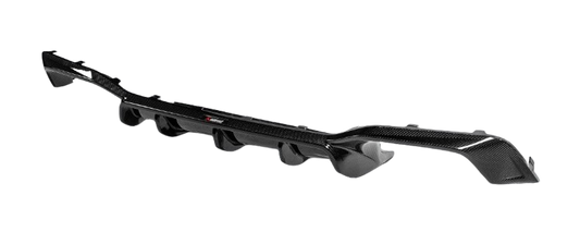 An Akrapovič carbon fibre rear diffuser, angled to show the fins and aerodynamic design