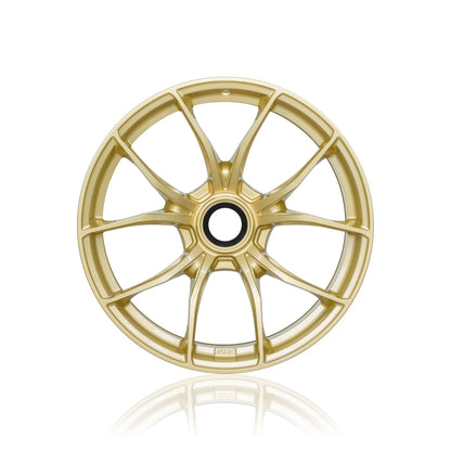 Front view of a gold IPE MFR-01 Magnesium wheel on a white background