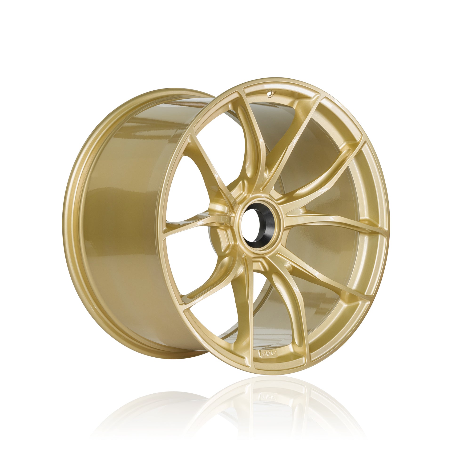 Offset front view of a gold IPE MFR-01 Magnesium wheel on a white background