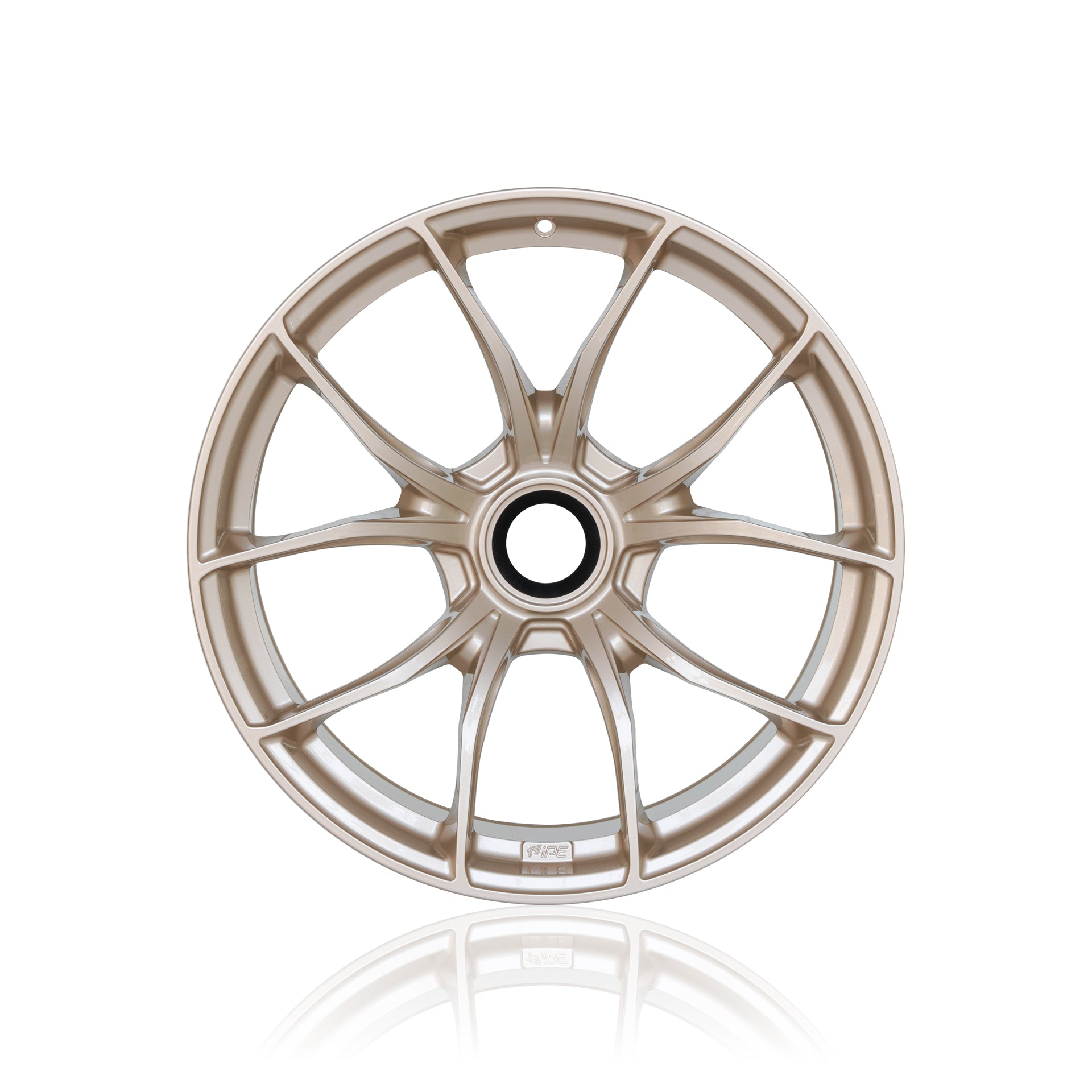 Front view of a light bronze IPE MFR-01 Magnesium wheel on a white background