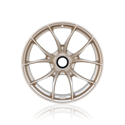Front view of a light bronze IPE MFR-01 Magnesium wheel on a white background