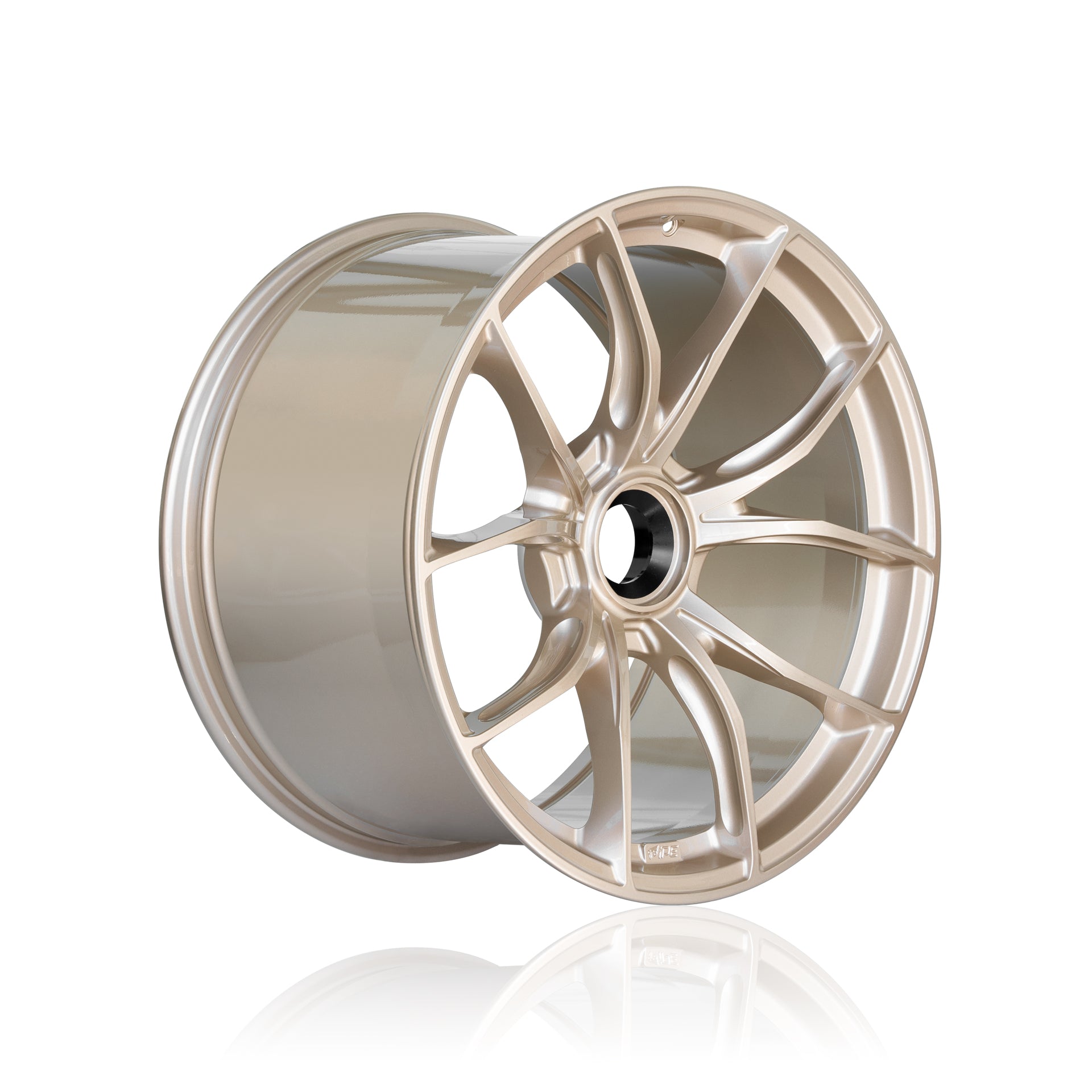 Offset front view of a light bronze IPE MFR-01 Magnesium wheel on a white background