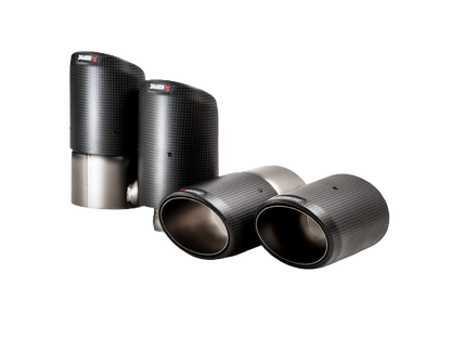 A pair of Akrapovič twin double round tail pipes with a carbon fibre finish