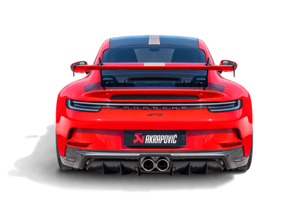 A rear view of a Red Porsche 911 992 GT3 with an Akrapovič twin round tail pipe exhaust & rear carbon fibre diffuser, with a matte finish, fitted