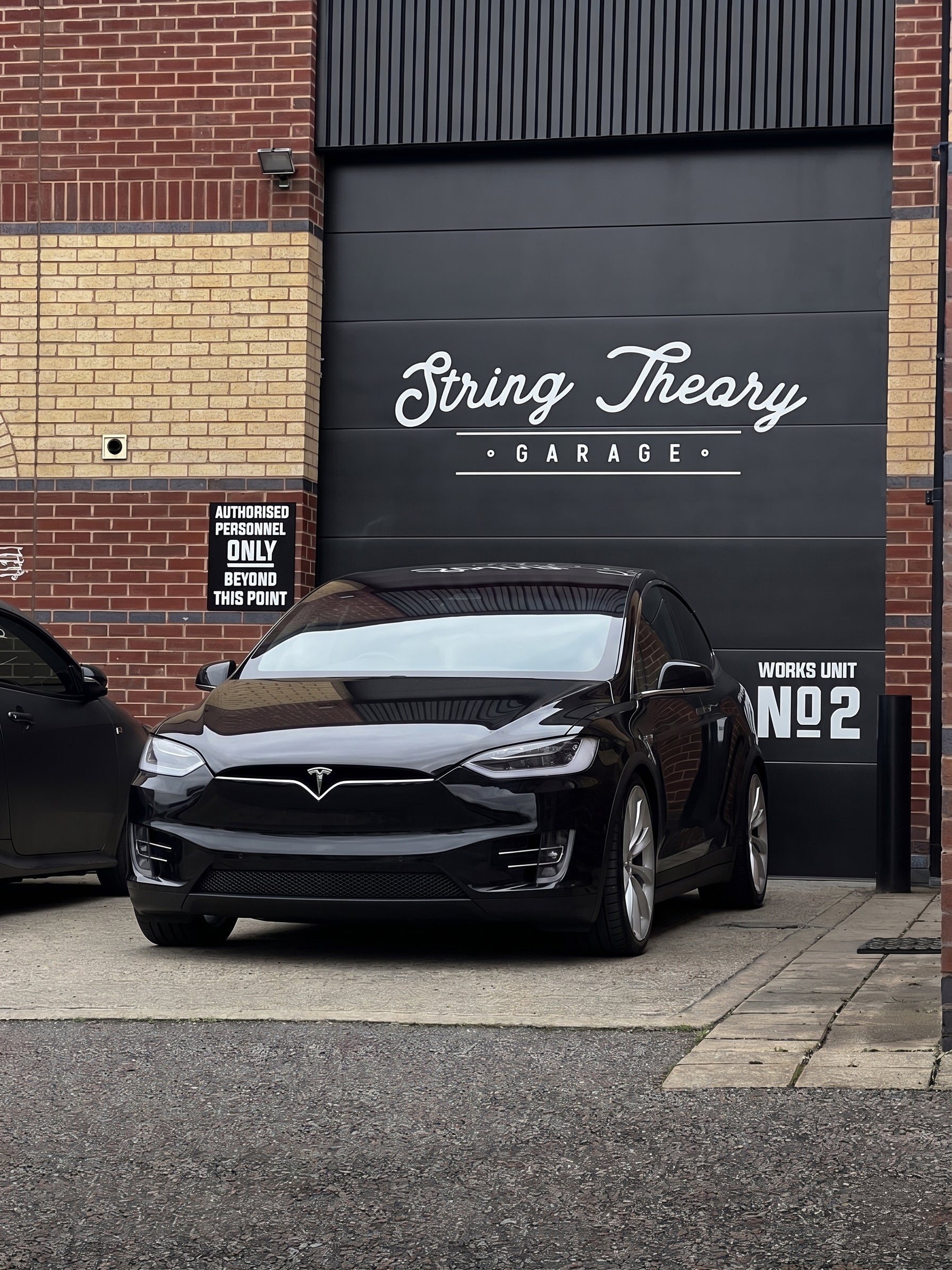 Tesla Model X Lowered on PWRD Lowering Links and Hubcentric 20mm Wheel Spacers Low Slammed Stanced  String Theory Garage