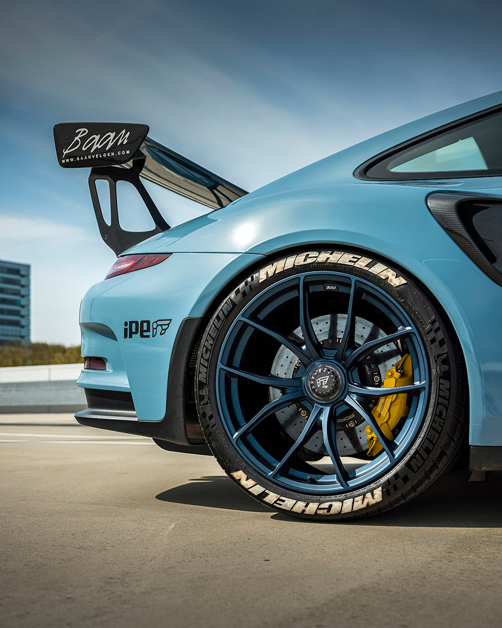 View of an IPE MFR-01 Magnesium wheel in blue with a multi-spoke design with a Michelin tyre fitted & fitted to a Porsche