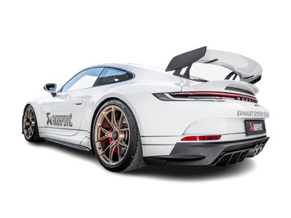 Nearside rear view of a Porsche 911 992 GT3 in white with black trim, gold alloy wheels and an Akrapovič Titanium twin pipe exhaust fitted