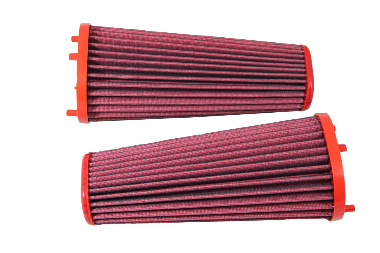 Two BMC high-performance automotive air filters, characterized by their red filtration media and red plastic end caps