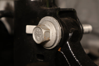 An Eibach front camber bolt fitted to a vehicles suspension