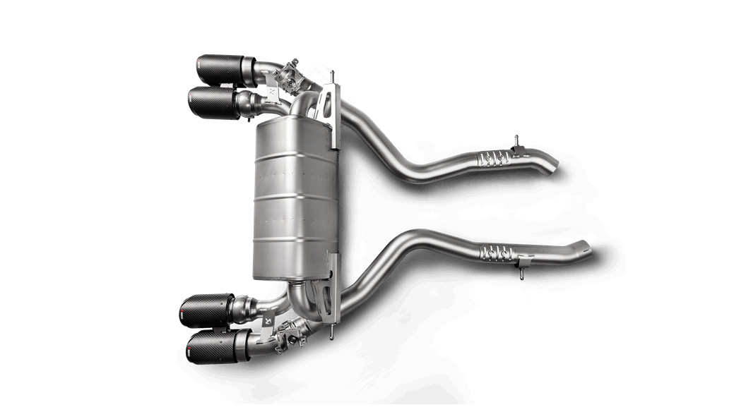 Aerial view of an Akrapovic titanium exhaust system with quad tips for a BMW M2 Competition F87N