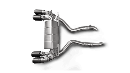 Aerial view of an Akrapovic titanium exhaust system with quad tips for a BMW M2 Competition F87N